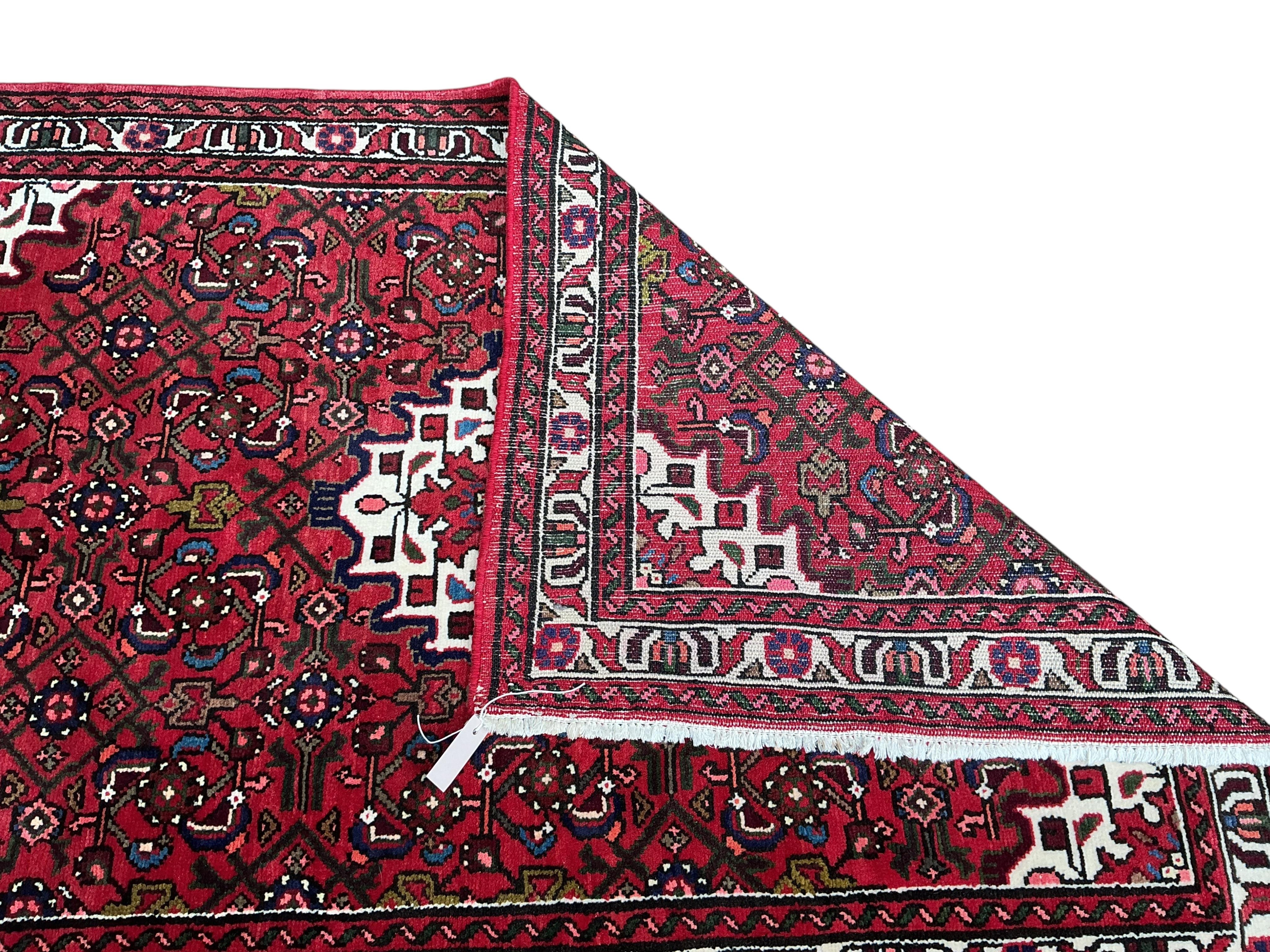 A Hamadan red ground rug, 160 x 110cm